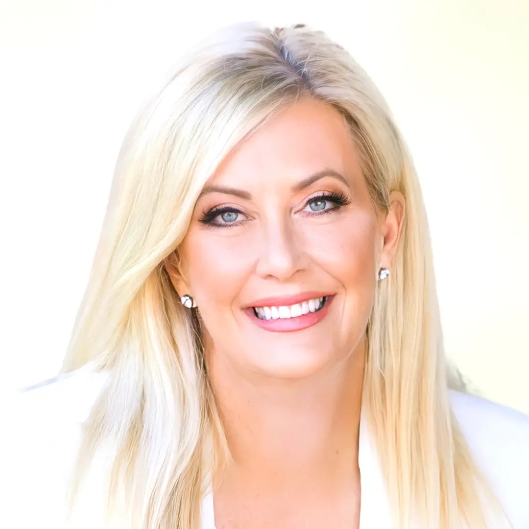 Headshot of Wendi Burkhardt, Chief Growth Officer at Edited Capital, smiling with long blonde hair and a white blazer.